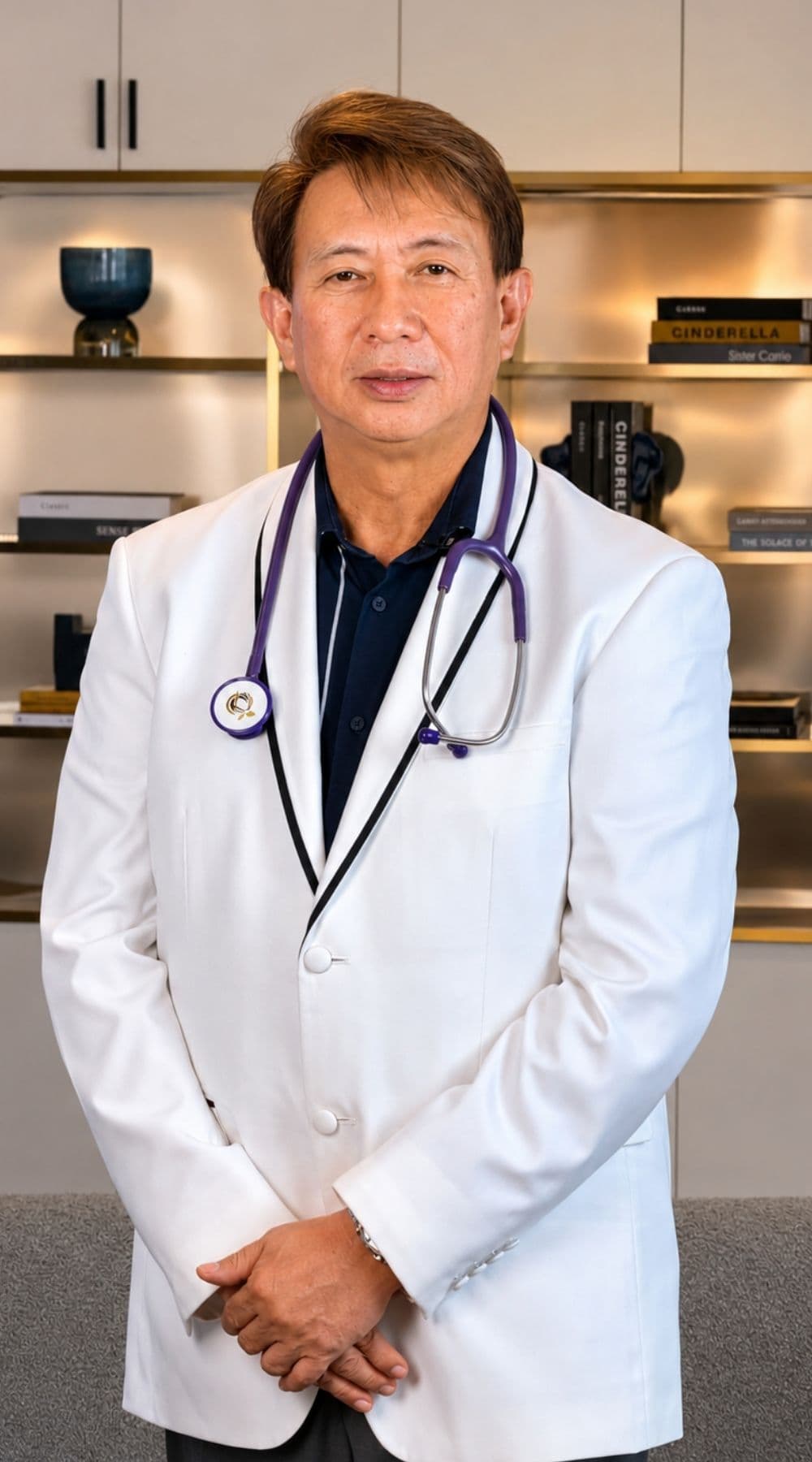 Portrait of Dr. Carlito Cubelo, Founder and Medical Director of BioRenew, standing in a white medical coat with a stethoscope.